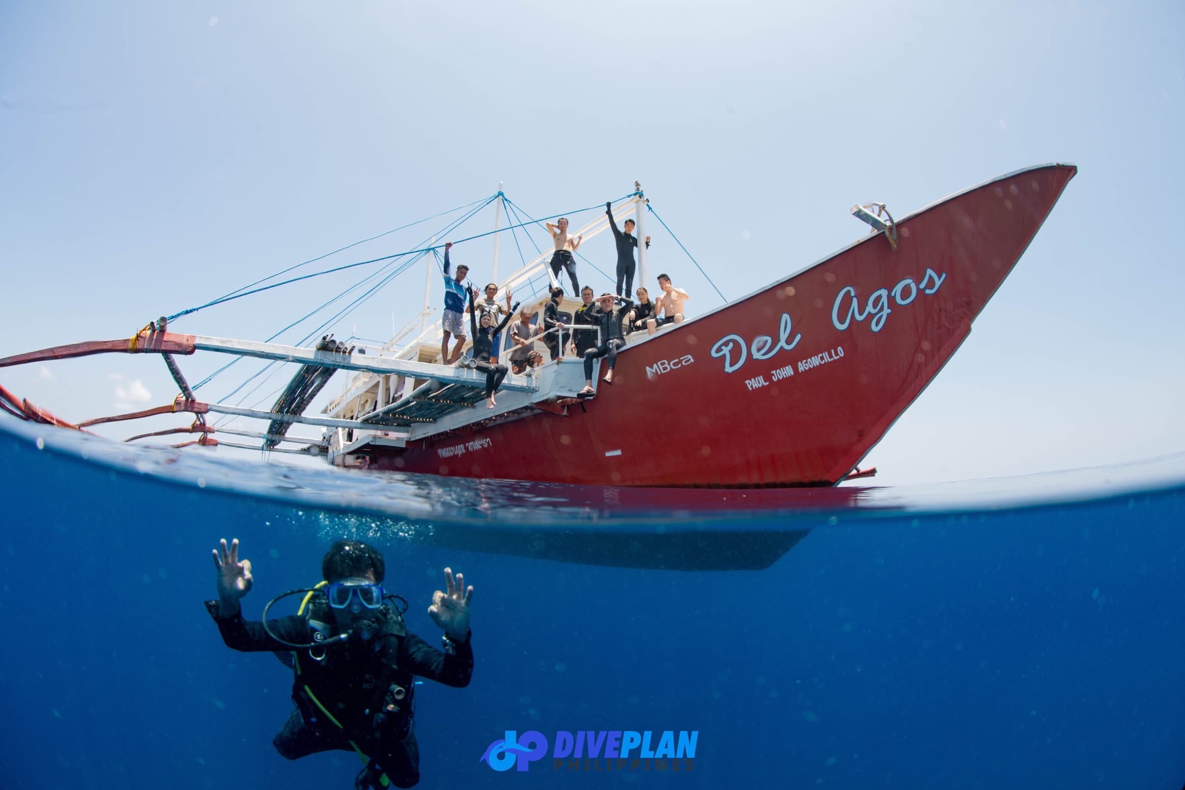 Divers in Apo Reef Natural Park by Jeru Cajapin