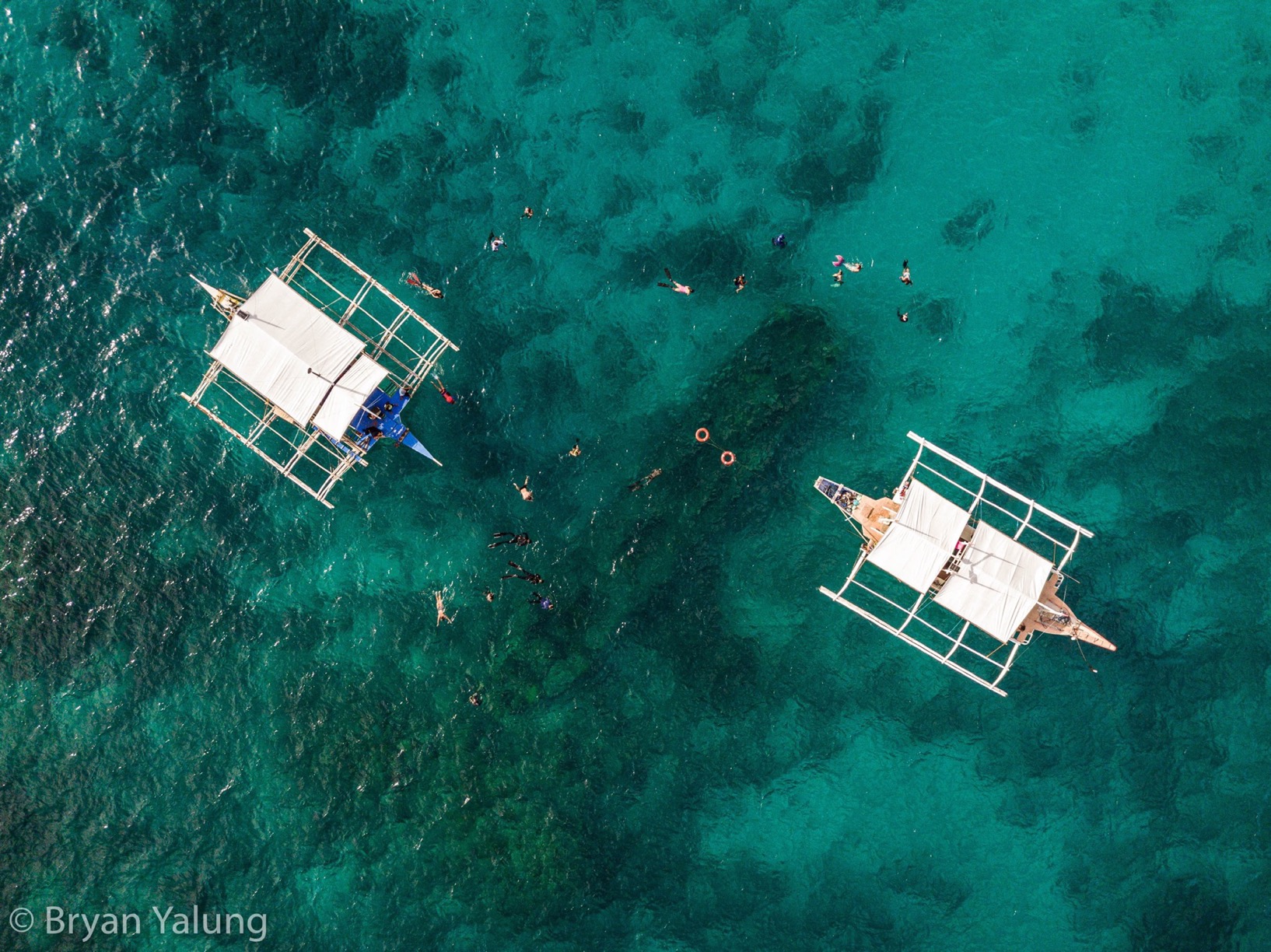 Two boats in Apo Reef Natural Park by Bryan Yalung